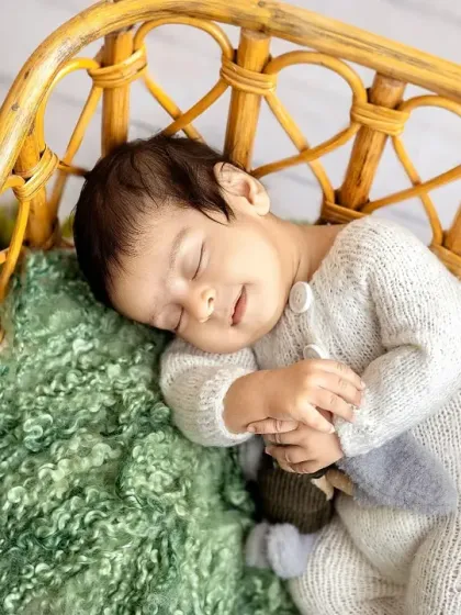 A sweet smile in his sleep. I'm always ready to capture these fleeting expressions that show the happy dreams your little one is having.
