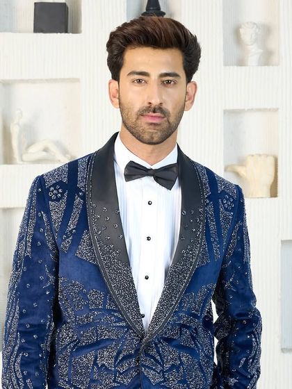 The boldest of my blue tuxedos, this one is fully embellished with a glittering silver pattern. It is designed for the man who wants to be the center of attention at any celebration.