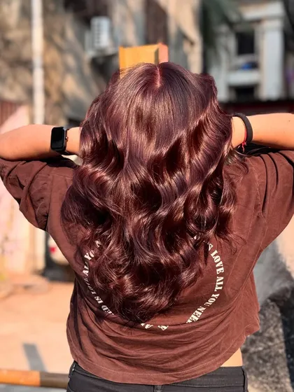 The back view of the 'Brownie' color, styled in soft waves that catch the light beautifully.