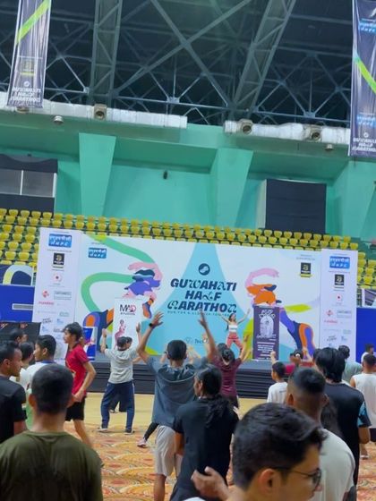 A wide shot of the Zumba warm-up session I conducted for the Guwahati Half Marathon. I can command a large space and lead hundreds of participants in a synchronized, energetic routine.