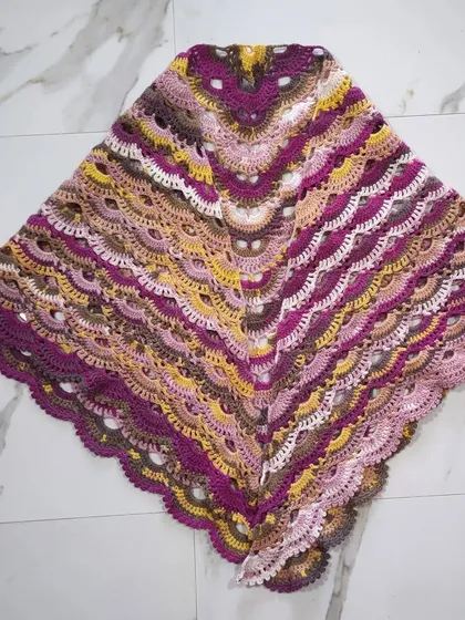 This is the beautiful and intricate Virus Shawl, a very popular pattern in the crochet community. I truly enjoyed watching the gorgeous colors of the papatya batik yarn unfold in these lacy, fan-like stitches. It creates a wonderfully light and airy wrap.