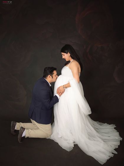A tender moment between the parents-to-be. A kneeling kiss to the baby bump is a classic and heartfelt pose that we love to capture during our maternity sessions.