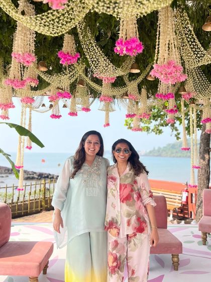 Here we are, Jinal and Neha, on-site at a beautiful beachside wedding. Over the years, we've grown into more than just business partners. Neha's kids call Jinal 'Maasi,' and that says more about our bond than any co-founder title ever could.