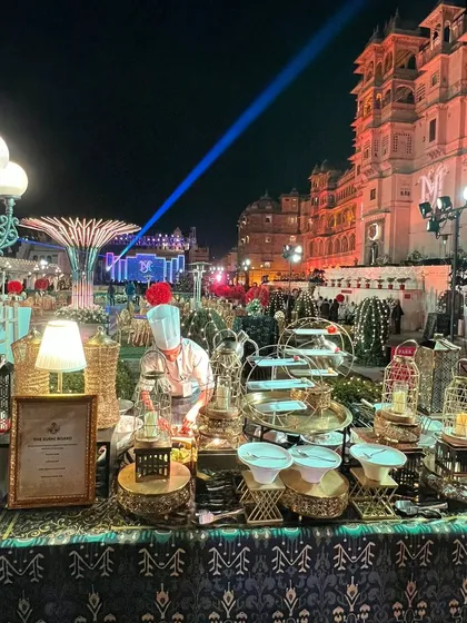 A spectacular wedding buffet set against the royal backdrop of Udaipur's City Palace. Our live stations and elaborate displays are designed to match the opulence of the venue, providing a feast fit for royalty at this grand destination wedding.