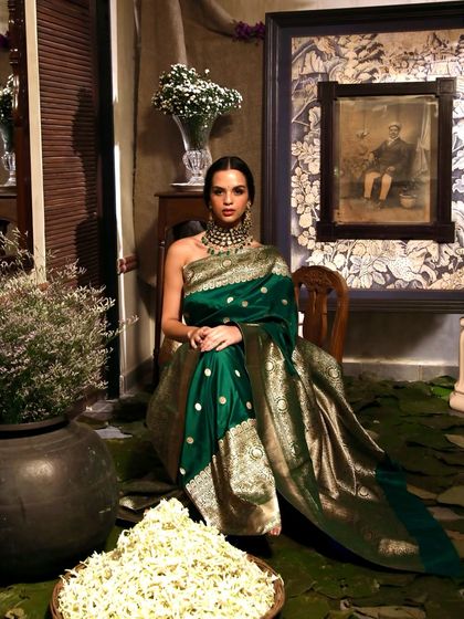 This full-set view shows how we integrate decor elements like flowers and pottery to build a rich, atmospheric scene for fashion photography. Every detail is curated to enhance the final image.