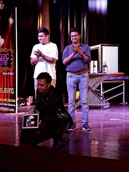 Taking a bow with audience volunteers on stage at my 'Las Vegas Magic Show'. This public show combines grand illusions with interactive digital magic, bringing a taste of Vegas to a theatre audience.