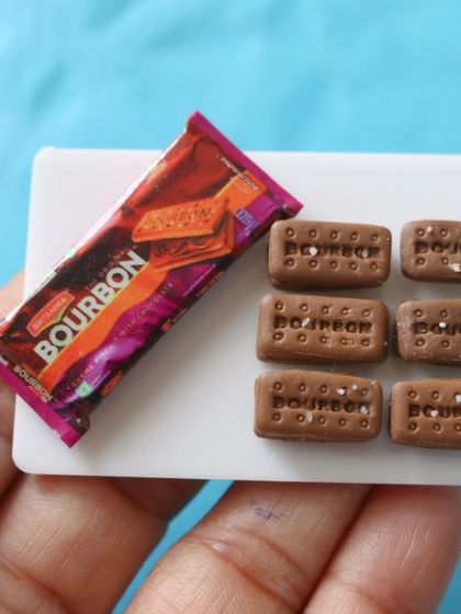 A miniature packet of Bourbon biscuits, a classic chocolate cream biscuit.