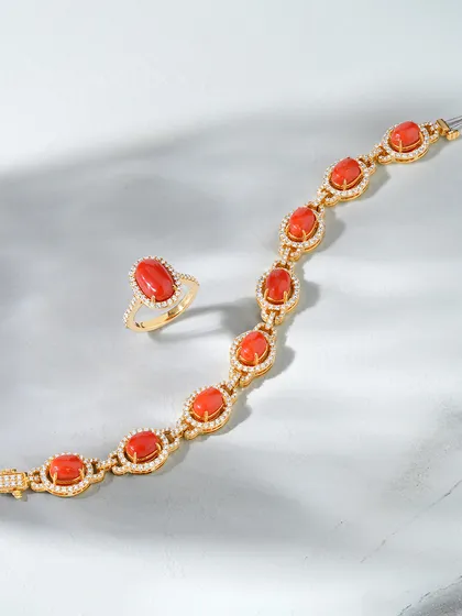 The Coral Elegance Set. This handcrafted bracelet and matching ring feature vivid coral stones set in rich gold, surrounded by delicate diamond accents. It is a perfect balance of boldness and grace, designed with you in mind.