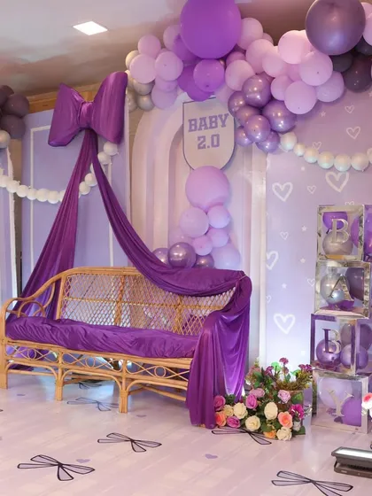 Another angle of the bow-themed decor, showing the 'BABY' blocks and the adorable pink teddy bear. Every detail is coordinated to create a cohesive and stylish look.