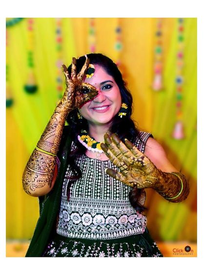 A fun and playful pose by the bride during her Mehndi ceremony. We encourage our clients to have fun while we capture their personalities.