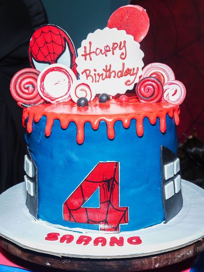 A close-up of the incredible Spiderman cake, complete with cityscapes and web details. I work to make the cake a true centerpiece of the celebration.