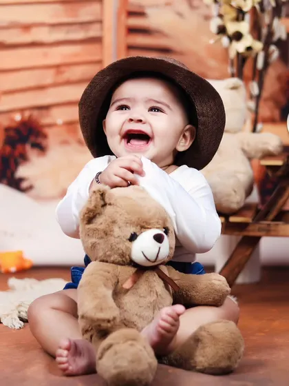 A genuinely happy laugh from this little boy during his sitter session. We aim to create a relaxed atmosphere to capture these priceless expressions.