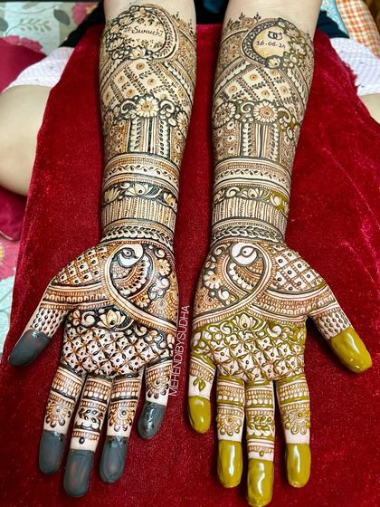 The complete engagement set for Ruchita, with matching peacock designs and personalized with her and her fiancé's names.