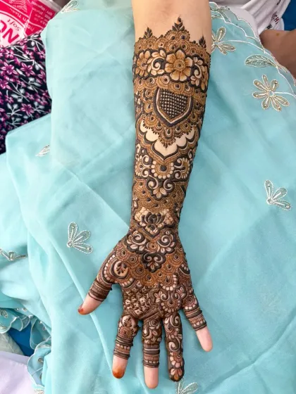 A closer look at a single arm from a full bridal set. You can see the fine details in the heart motif, the delicate flowers, and the intricate line work that I love to create.