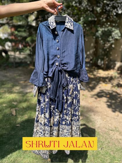 A closer look at my navy blue coordinated set. The girl's outfit features a stylish tie-front shirt, while the boy's kurta has a matching embroidered collar, creating a chic and modern twinning look.