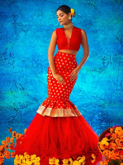 A vibrant, artistic background with a bright blue texture, created with projection. This allows me to use color and pattern to complement the fashion in a bold, celebratory way.