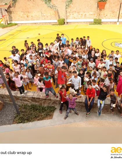 This is what our community looks like. A huge, vibrant group of students from our 'Reach Out!' service club coming together for a day of fun and connection. This image captures the joy, diversity, and spirit of service that we nurture in every student.