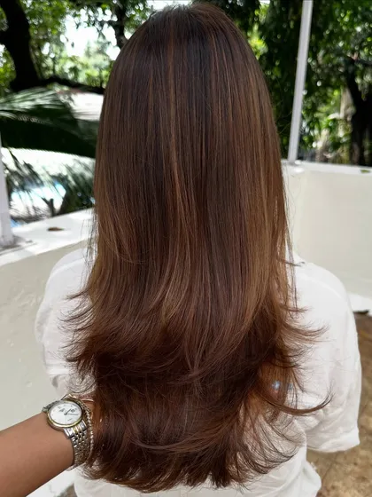 I love that this client comes all the way from New York for her hair sessions. This is a classic color refresh, where I blend her roots and brighten her highlights for a seamless look.