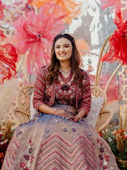 A bride glowing amidst our 'Terracotta Tales' decor. We designed this boho-chic Haldi with rattan peacock chairs and a backdrop of handmade paper flowers to create picture-perfect, Pinterest-worthy moments.