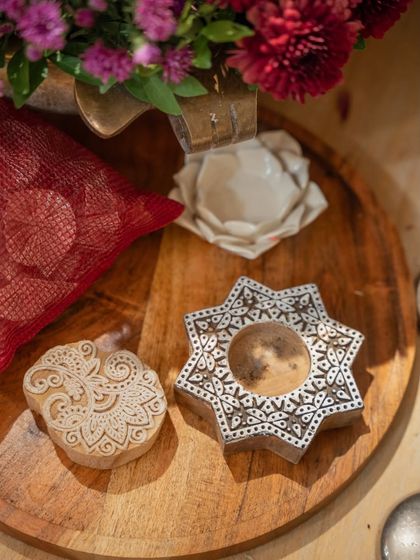 Every detail blooms in harmony. These traditional wooden block stamps were part of the decor, adding an authentic and artistic touch to the "Garden of Vows" theme.