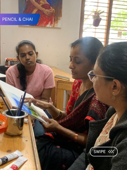 I review a student's landscape painting, offering suggestions for improvement. This collaborative review process is an essential part of how we guide students to develop their skills.