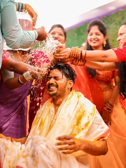 The groom's reaction as he is doused with water during the Haldi ceremony. These are the fun, unscripted moments that make the best memories.