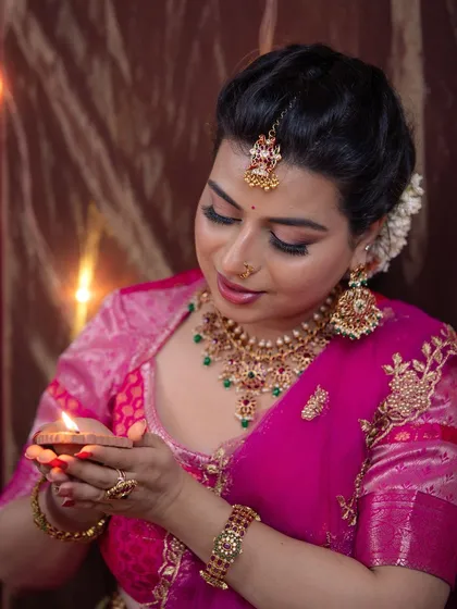 A serene moment captured during the Diwali shoot. This close-up shows the soft shimmer on the eyes and the overall warmth of the makeup look.