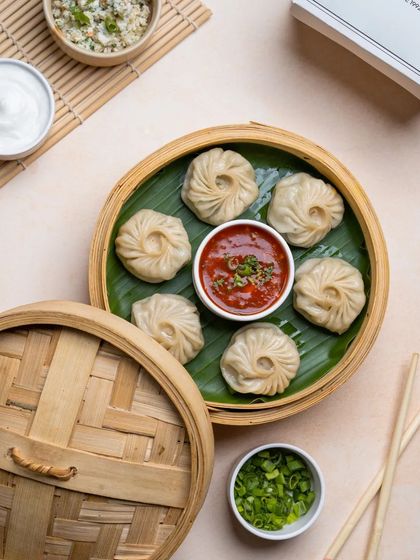 Our round, purse-shaped momos, steamed to perfection. This style of dumpling is packed with filling and is a favorite among our customers.