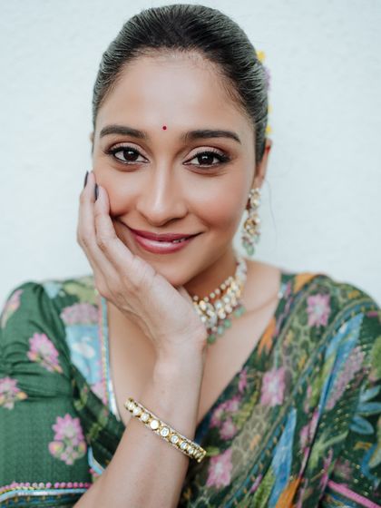 A close-up beauty shot that captures a sweet and gentle expression. This type of portrait is perfect for showcasing makeup and traditional jewelry in detail.