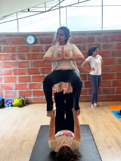 This is what trust looks like. In our Acro Yoga workshops, we learn to lift each other up, both literally and figuratively. It’s a practice of shared gravity, communication, and playful connection.