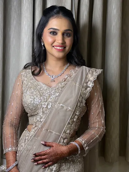 A quick touch-up and a second look for Soniya's engagement, featuring a stunning sequined lehenga.