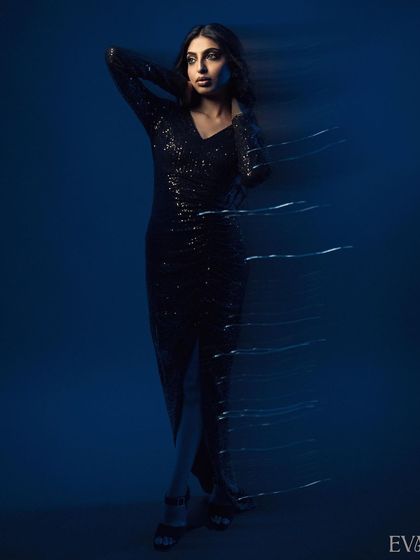 Another full-length pose from the motion series, capturing an elegant and strong stance. The light trails follow the model's form, adding to the artistic effect.