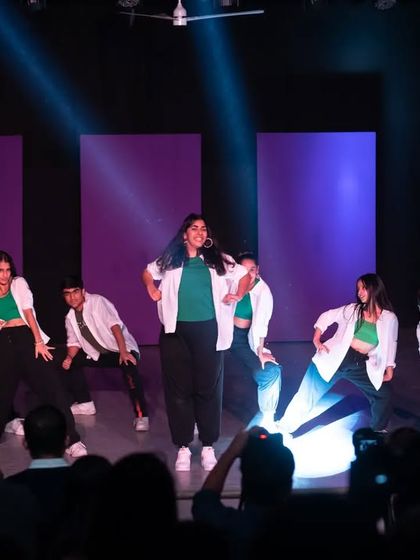 The crew hitting a sharp pose during a performance. Precision and clean execution are key takeaways from my pro-performance training batches.