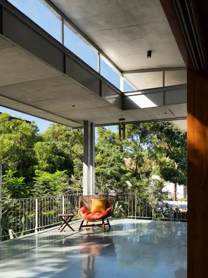 A wide, covered terrace that acts as an outdoor living room, demonstrating our design of functional, weather-protected open spaces.
