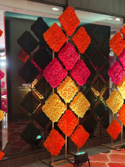 Another view of the unique marigold wall art, reflecting in the mirrored walls of the hallway.