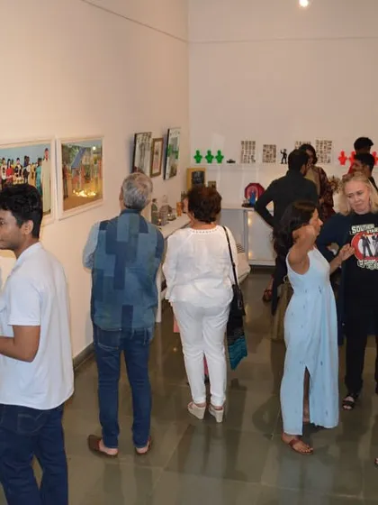The artist, Clare Arni, interacting with guests on opening night.