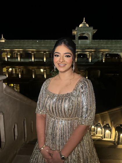 A happy and radiant look for an evening function. The silver sequined dress is paired with a classic winged liner and a beautiful smile.