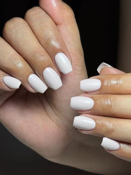 Clean, crisp, and classic. These short, square-shaped nails with a solid white gel polish are perfect for a fresh and minimalist look.