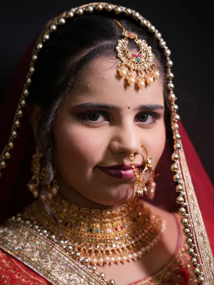 A portrait of the North Indian bride created by a student, demonstrating their ability to create a breathtaking final look.
