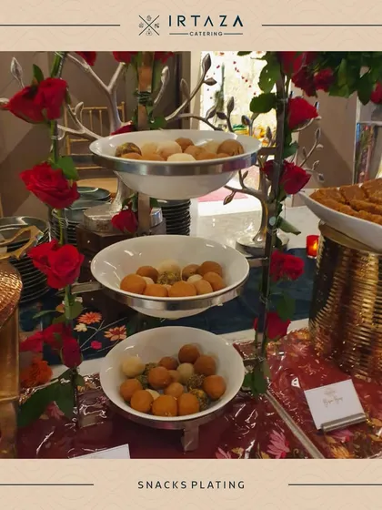 A tiered platter showcasing a variety of bite-sized snacks. This type of display is great for encouraging guests to try a little bit of everything.