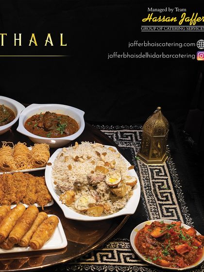 A closer look at the components of our Iftar Thaal. You can see the fragrant biryani, assorted fried appetizers like spring rolls, and rich mutton curries, ready to be enjoyed.