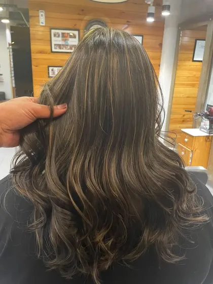 These are traditional highlights that give a beautiful, sun-kissed effect. The mix of tones adds a lot of dimension.