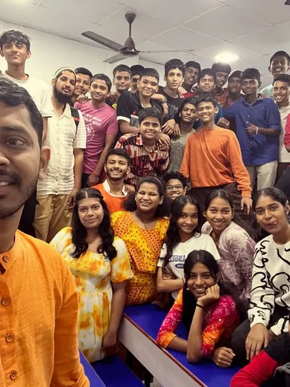 A classroom full of energy, celebrating Day 7 of Navratri in bright orange. The smiles on their faces say it all.