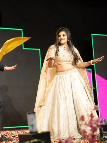 My bride owning the stage during her sangeet performance. Her makeup is glamorous and dance-proof, ensuring she looks perfect through every move.