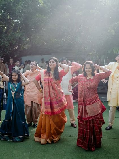 Guests from different backgrounds come together to perform a dance at a multicultural Sangeet.