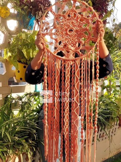 A client wanted a statement piece that was grand yet intricate, and she chose this 4-foot-tall macramé dreamcatcher. It instantly became the centerpiece of her space, adding depth and elegance.