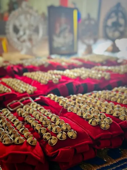 The ghungroo is more than just an anklet of bells; it's a sacred part of a dancer's journey. This close-up shows the ghungroos, blessed and ready for my students during the Ghungroo Pooja ceremony, a tradition we deeply cherish.