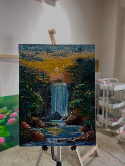 A serene waterfall landscape captured in acrylic paint on canvas. This beautiful piece was created by one of our dedicated members over several sessions.