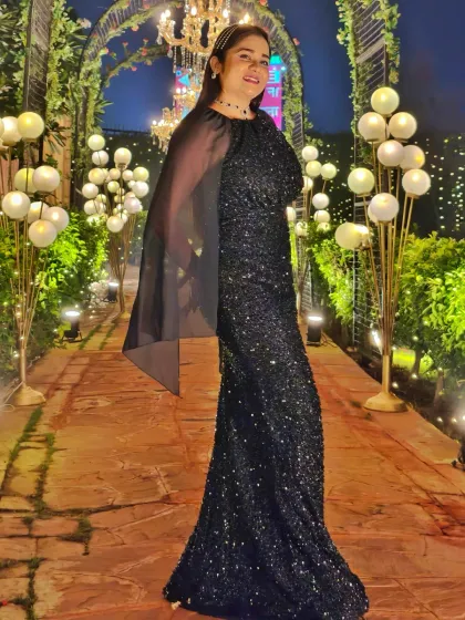 A full-length view of my sparkling black gown for a Sangeet night. The right outfit helps me command the stage and adds to the glamorous atmosphere of the event.