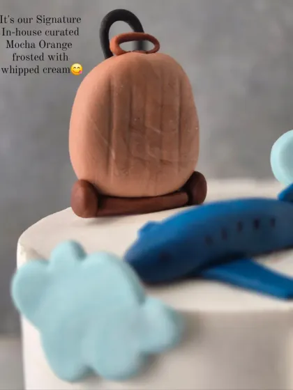 A close-up of the handcrafted fondant suitcase on the Bon Voyage cake.